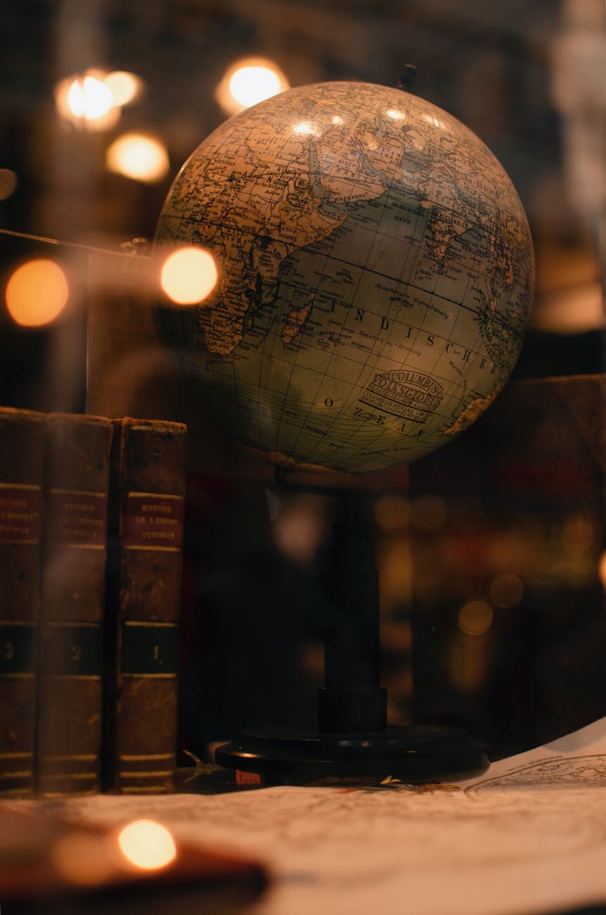 old books and globe in library